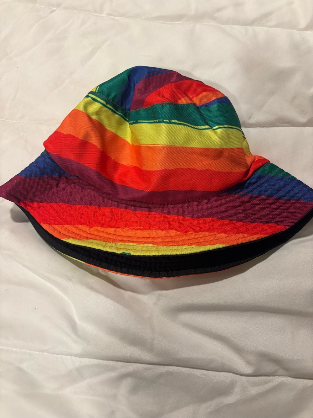 multicolored rainbow-striped bucket hat with a reversible design one size